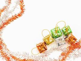 Part of Christmas tree and colorful gift boxes isolated on white background. Space for text. Top view. Flat lay. Christmas and Happy New Year concept photo