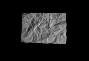 Top view of crumpled paper on a black background photo