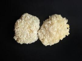 White dried Snow Fungus on black background photo