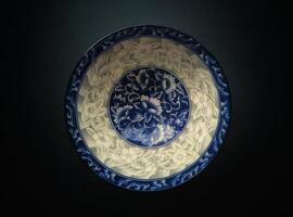 A blue and white plate with a design on it photo