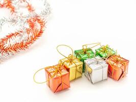 Part of Christmas tree and colorful gift boxes isolated on white background. Space for text. Top view. Flat lay. Christmas and Happy New Year concept photo
