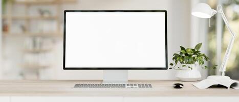 A computer desk in a modern, minimal white home office features a PC computer white-screen mockup. photo