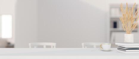 A presentation space on a white dining table in a modern white dining room. photo