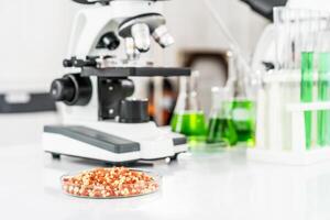 Samples of soil, microscope and test tubes on table in laboratory, Science and education. Scientific experiment, Researcher, Concept of medical or science laboratory photo