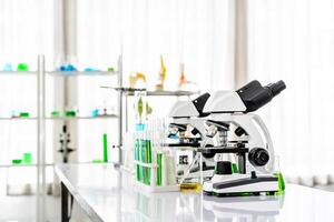 Colorful rows of laboratory or classroom test tubes and microscope with metal lens, Science and education. Scientific experiment, Researcher, Concept of medical or science laboratory, photo