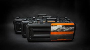 Black plastic container with foam inside for safe storage and transportation of fragile and expensive items. Sturdy plastic case. Dark back photo
