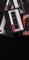 Close-up of many audio tapes. Analog storage medium. Cassettes for audio recordings and music. Vintage music back photo