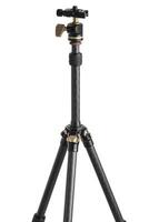 Small modern lightweight carbon tripod. Foldable tripod for photo and cameras. Isolate on a white back.