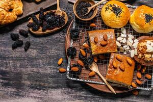 Top view of bread and loaf with cereals bread and bakery, breadsticks on wooden table in dark background with copy space photo