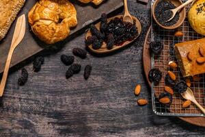 Top view of bread and loaf with cereals bread and bakery, breadsticks on wooden table in dark background with copy space photo