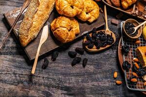 Top view of bread and loaf with cereals bread and bakery, breadsticks on wooden table in dark background with copy space photo