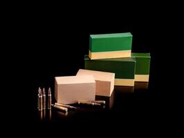 Cartridges for a rifle on a dark back. Different boxes with ammunition for weapons. Bullets for carbines and rifles. photo
