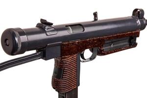 Vintage submachine gun isolate on white background. Weapons for the army and special forces of the past. Short automatic submachine gun. photo