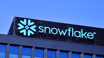 Warsaw, Poland. 31 July 2024. Wola business district in the city center with office centers and modern buildings. Urban landscape. Company signboard Snowflake. photo