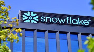 Warsaw, Poland. 31 July 2024. Wola business district in the city center with office centers and modern buildings. Urban landscape. Company signboard Snowflake. photo