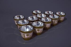 Minimal abstract background with set of teacup. Against the grey background. Front view, copy space photo