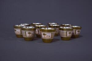 Minimal abstract background with set of teacup. Against the grey background. Front view, copy space photo