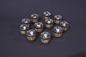 Minimal abstract background with set of teacup. Against the grey background. Front view, copy space photo