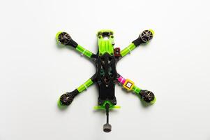 top view, twisting drone frame parts, soldering and assembling fpv drone parts, human-assembled aircraft model. Close-up, high technology, drones photo