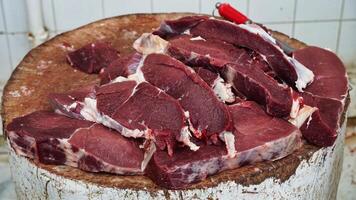 Fresh Beef Cuts on Wooden Butcher Block photo
