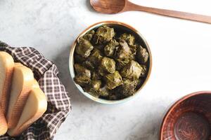 Stuffed Grape Leaves Served With Bread photo