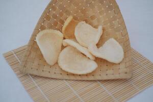 Fresh made Prawn Crackers on bamboo mat photo