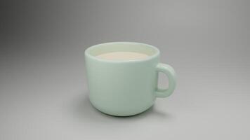 a green cup with a handle on a gray surface photo