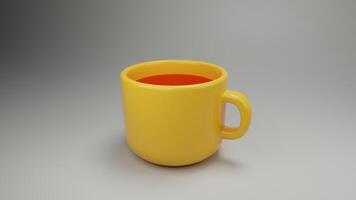 a yellow mug with a red handle on a gray surface photo