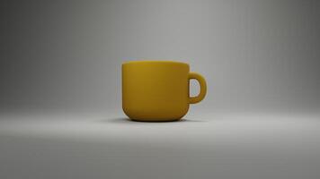 a yellow coffee cup sitting on a table photo