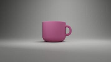 a pink coffee cup sitting on a table photo