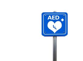 Blue sign displaying the AED symbol with the letters AED and a lightning bolt across a heart, with clipping paths. Safety and emergency concept. photo