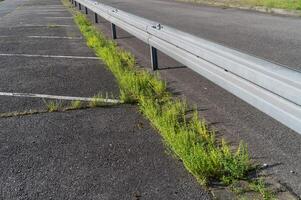 Guard rails on the road in the sun photo