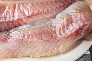 fillet raw white fish cod or halibut fresh meal food snack on the table copy space food background rustic top view photo