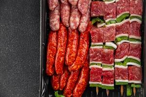 sausage meat assorted juicy pork, beef fresh delicious gourmet food background on the table rustick food top view copy space photo