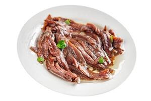 anchovies in a plate on the table canned fish in oil fresh and tasty seafood meal food snack on the table copy space food background rustic photo