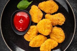 nuggets chicken meat deep fried fresh meal food snack on the table copy space food background rustic top view photo