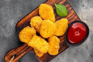 nuggets chicken meat deep fried fresh meal food snack on the table copy space food background rustic top view photo