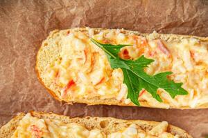smorrebrod salad spread surimi and crab sticks, mayonnaise fresh meal food snack on the table copy space food background rustic top view photo