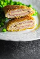 cutlet cordon bleu chicken meat, cheese, bacon meal snack on the table copy space food background rustic top view photo