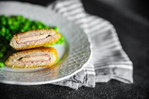 cutlet cordon bleu chicken meat, cheese, bacon meal snack on the table copy space food background rustic top view photo