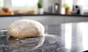 Smooth dough for bread on a granite countertop photo