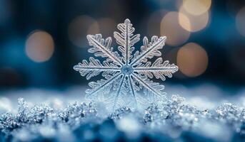 A snowflake is sitting on top of a snow covered ground. The snowflake is surrounded by a blue and white background photo