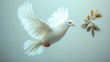 A white dove is flying in the air and is about to land on a leaf. Concept of peace and tranquility, as the dove is a symbol of peace and freedom photo