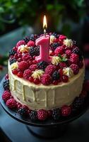 A cake with a lit candle on top and berries on the sides. The cake is decorated with a pink number 1 candle photo