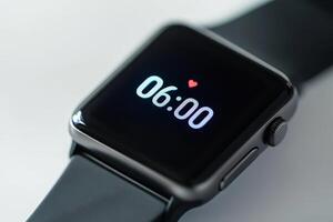 Close up of modern smartwatch with time six oclock photo