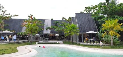 Beautiful view of The Danau Resort and Villa or Bebek Tepi Sawah famous Restaurant cabang Ubud Bali in Makassar - Gowa. South Sulawesi, Indonesia - August 7 2024 photo