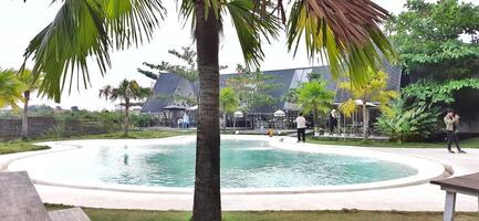 Beautiful view of The Danau Resort and Villa or Bebek Tepi Sawah famous Restaurant cabang Ubud Bali in Makassar - Gowa. South Sulawesi, Indonesia - August 7 2024 photo