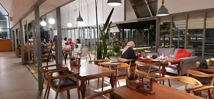 Beautiful view of The Danau Resort and Villa or Bebek Tepi Sawah famous Restaurant cabang Ubud Bali in Makassar - Gowa. South Sulawesi, Indonesia - August 7 2024 photo