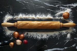 Wooden Rolling Pin and Onions on Black Marble Surface with Flour Cooking Concept for Recipes, Kitchen Design, and Food Blogs photo