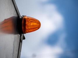Additional turn signal mounted on the container on the transport vehicle photo
